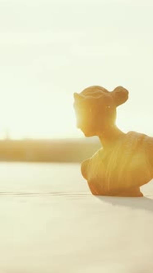 Goddess of Love in Greek Mythology on the Sand of the Beach