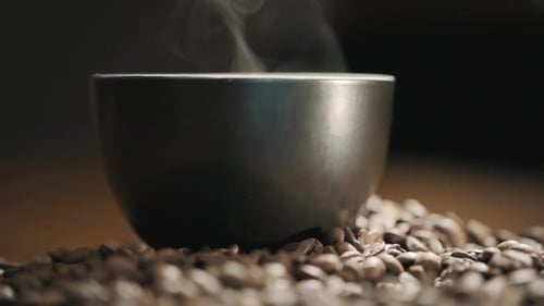 Steaming Bowl on Bed of Coffee Beans