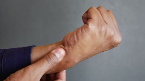 Man Suffering Pain in Hand Close Up