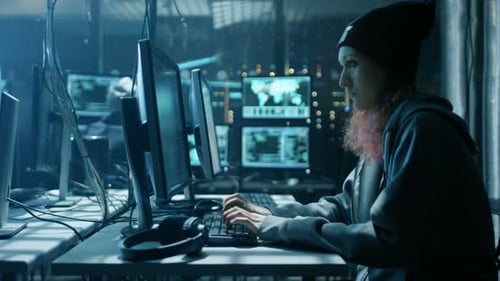 Woman Typing at Computer in Dark, Technical Setting