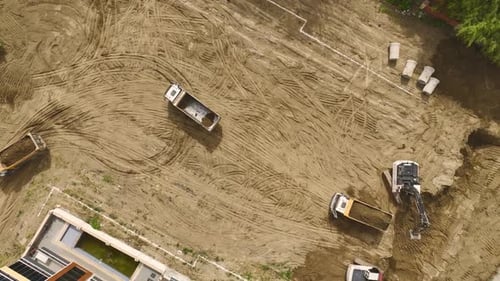 Construction Groundwork Aerial of Excavator and Trucks