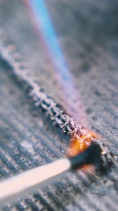 Applying Material Onto Heating Chain on Fireproof Surface