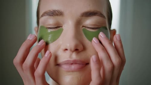 Happy Girl Applying Patches on Face Closeup Beautiful Model Doing Spa Routine
