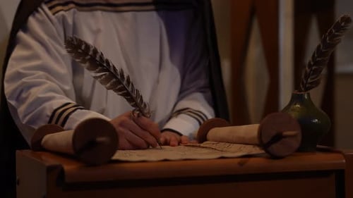 Ancient Writing with Quill and Ink Chronicler's Hand on Parchment Evolution of Human Communication