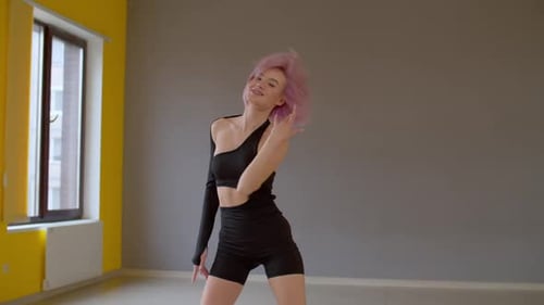 Stylish Woman Dancing in Modern Urban Studio