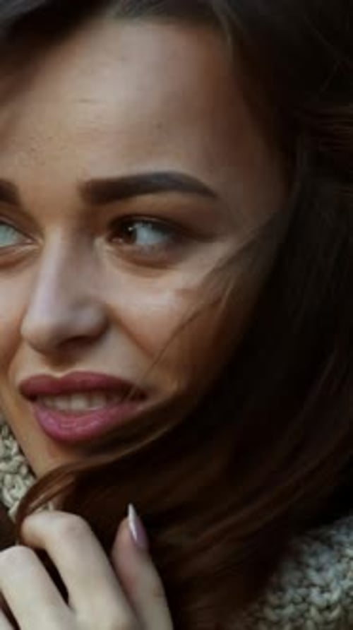 Sunny autumn day in park. Young woman spending time in autumn park