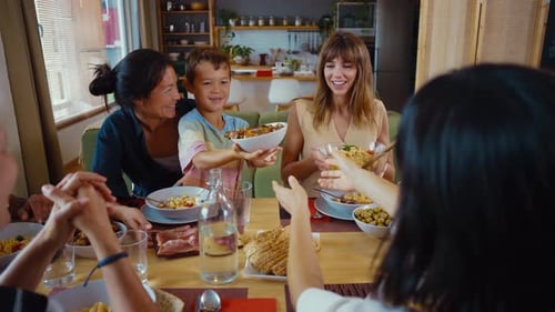 People Enjoying Lunch Together at Home Indoors