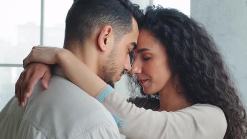 Side Close Up View Happy Wife Put Arms Around Husband Neck Partners in Love Hug Embrace Cuddle