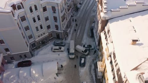 Top View Car Accident in the City After Heavy Snowfall