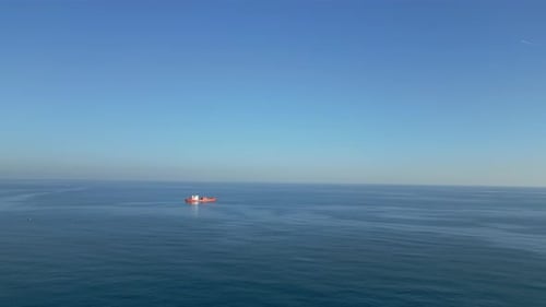 Camera Flies Up From Afar to a Chemical Tanker Standing in Place in Open Water