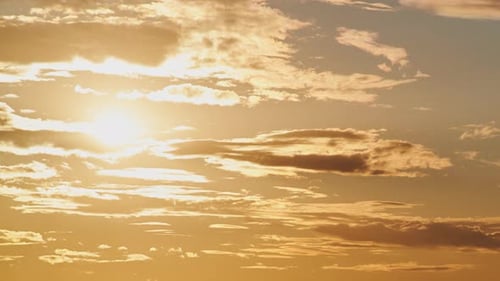 The clouds during the sunset were tinged with shades of yellow and orange, creating a warm and invit