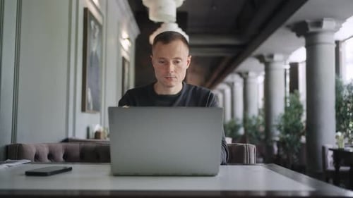 Frontal Portrait Of Businessman Working Online With Laptop In Cafe In Daytime Person With Gadget