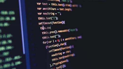 Programmer Coding on Computer