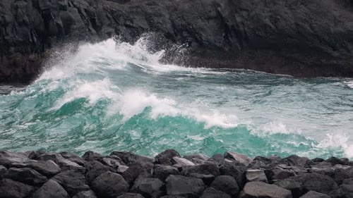 Ocean Waves Crashing on Rocky Shoreline Landscape