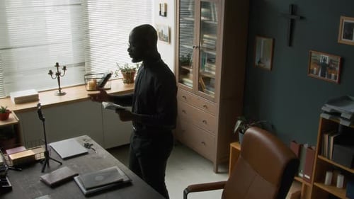 Adult Preaching Sermon to Camera in Home