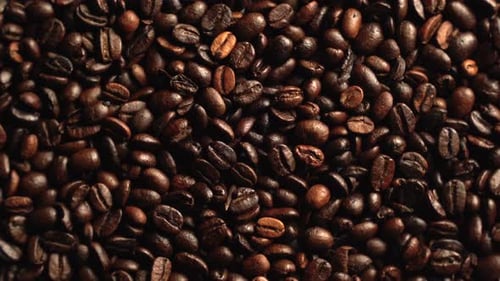 Pile of Dark Roasted Coffee Beans Close Up
