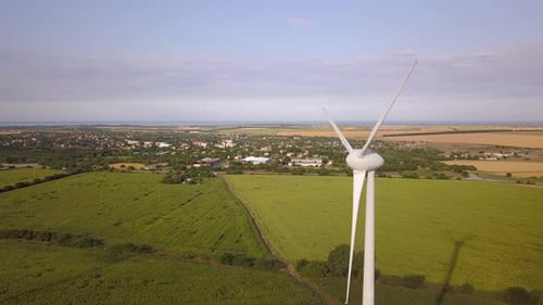 Aerial View of Wind Turbine Generators in Field Producing Clean Ecological Electricity