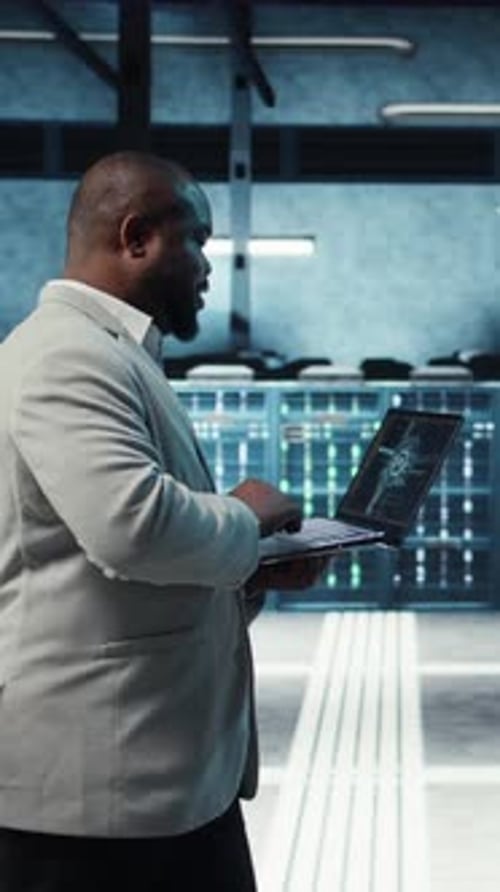 Vertical Video Server Room System Administrator Using Laptop to Do AI Automatization