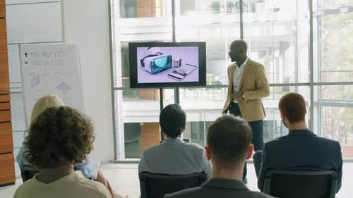 Speaker Presenting New Product to Audience