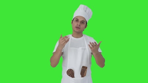 Indian professional talking to someone Green screen