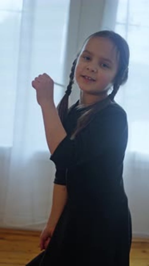 Expressive Young Child Dances at Home