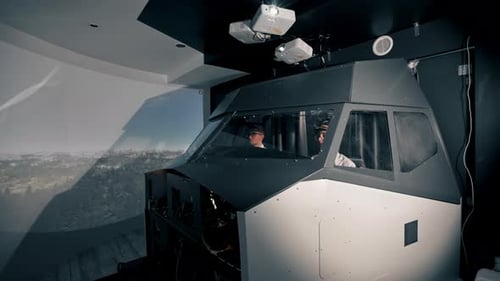 young pilots in the cockpit of the plane control air transport during long distance flight simulator