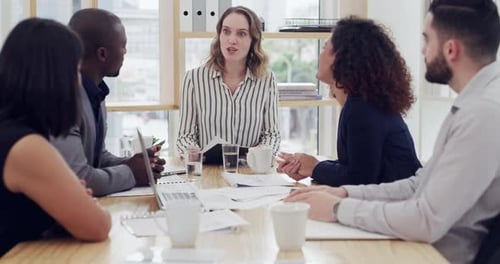 4k video footage of a diverse group of businesspeople sitting and having a meeting in the office