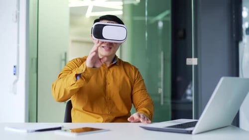 Man Using Virtual Reality Headset in Office