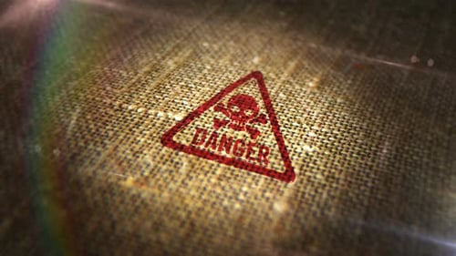 Danger sign stamp on linen sack