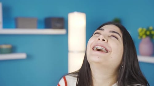 Smiling Woman Wearing Braces Looking Around