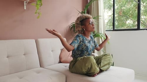 Woman Meditating in a Bright Home Living Space