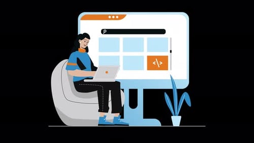 Woman using laptop in front of a large monitor