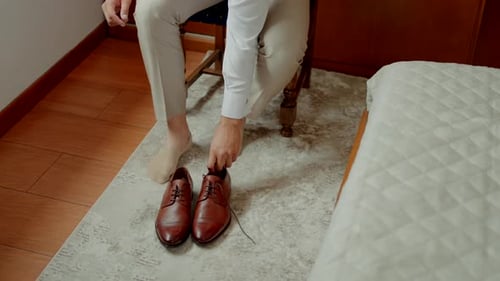 Man Getting Ready Putting on Leather Dress Shoes