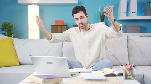 Man working from home at facetime business meeting.