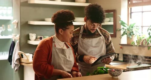 Couple Cooking Together in a Bright Home Kitchen