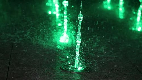 Colorful Lights In Water Fountain. City Center.