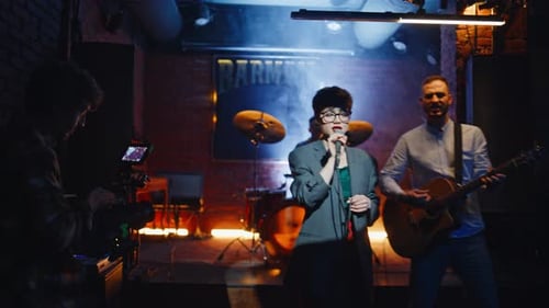 Rock Band Performing Stage Modern Nightclub Trendy Woman Singing Popular Song