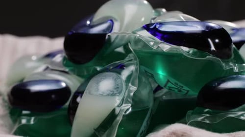 Laundry Detergent Pods on an Off-White Towel