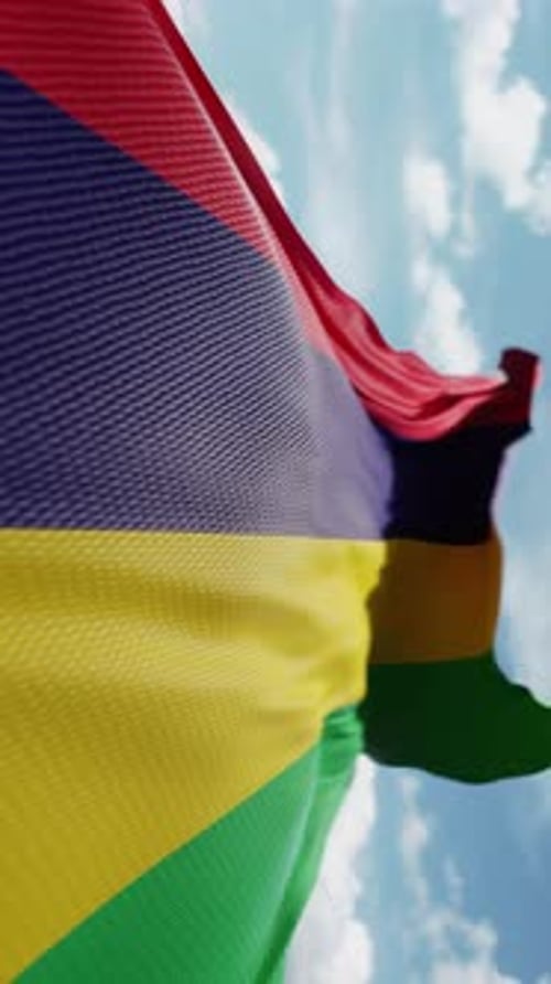 Vertical Waving Mauritius Flag Against Blue Sky Loop
