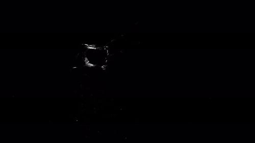 Fragment Collection: Glass breaking on a black background with a big bullet hole effect