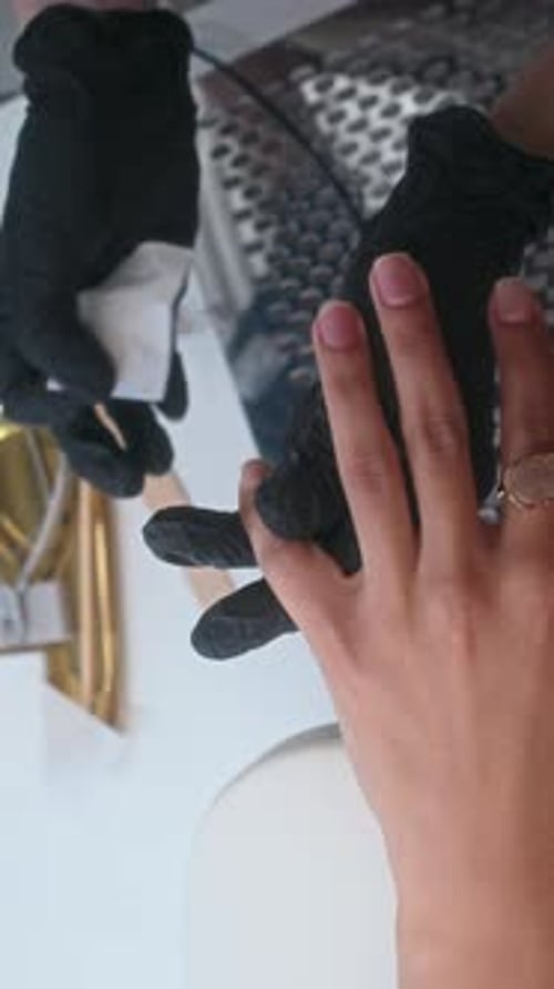 Nail Technician Preparing Nail Surface for Applying Basecoat