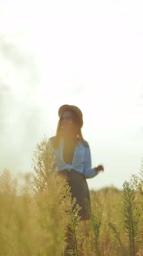 Woman Arriving at Car in Rural Field