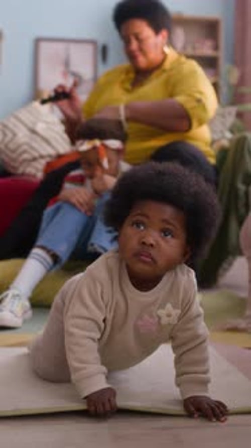 Baby Crawling in the Home with Family