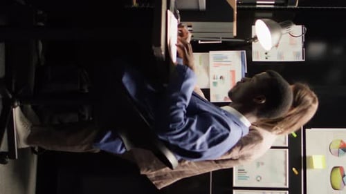 Coworkers Reviewing Data in Bright Office