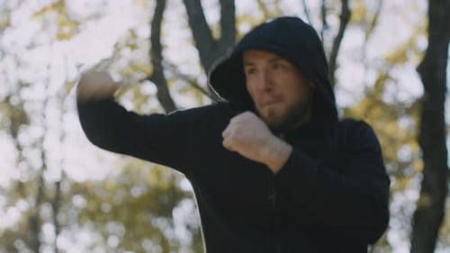 Young Man Jogging Outdoors for Fitness and Healthy Lifestyle in the Park