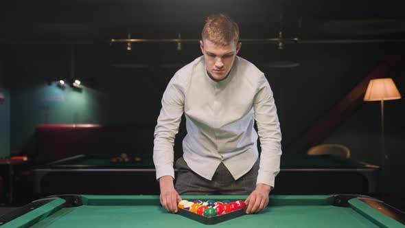 Billiard Player Arranges Triangle Formation of Balls on Green Pool ...