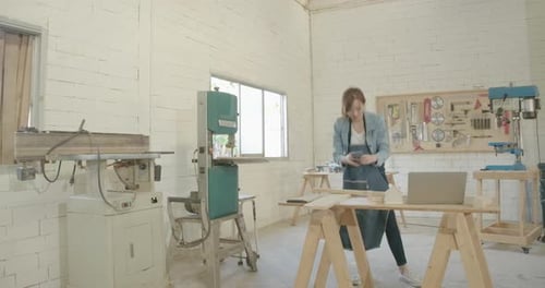 4K Hyper-lapse of Young asian woman carpenter building design house model