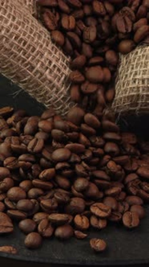 Coffee Beans Pouring From Sack in Vertical Footage