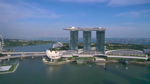 Marina Bay Sands Resort in Singapore. Drone forward flight at dusk