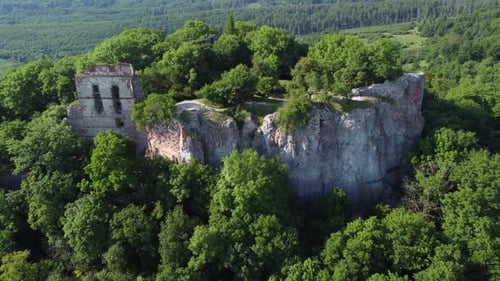 Flying Towards The Ruins Of Pajstun Castle On A Steep Reef